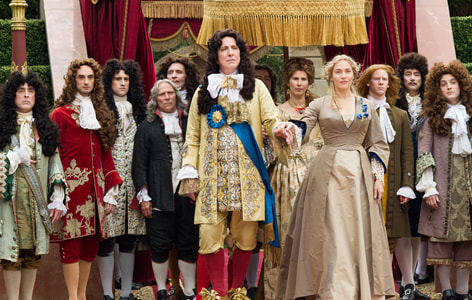 King Louise XIV played by Alan Rickman with 10 courtiers behind him as he holds the hand of Kate Winslet's character