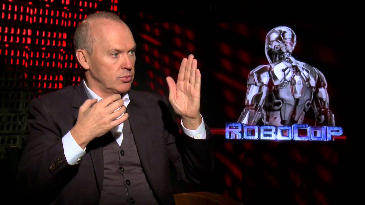 Michael Keaton sat down making karate-chop gestures during a press junkit for Robocop 2014