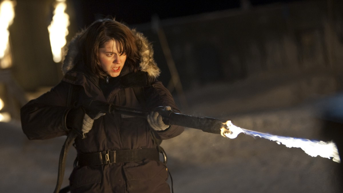 Woman using a flame thrower in The Thing 2011