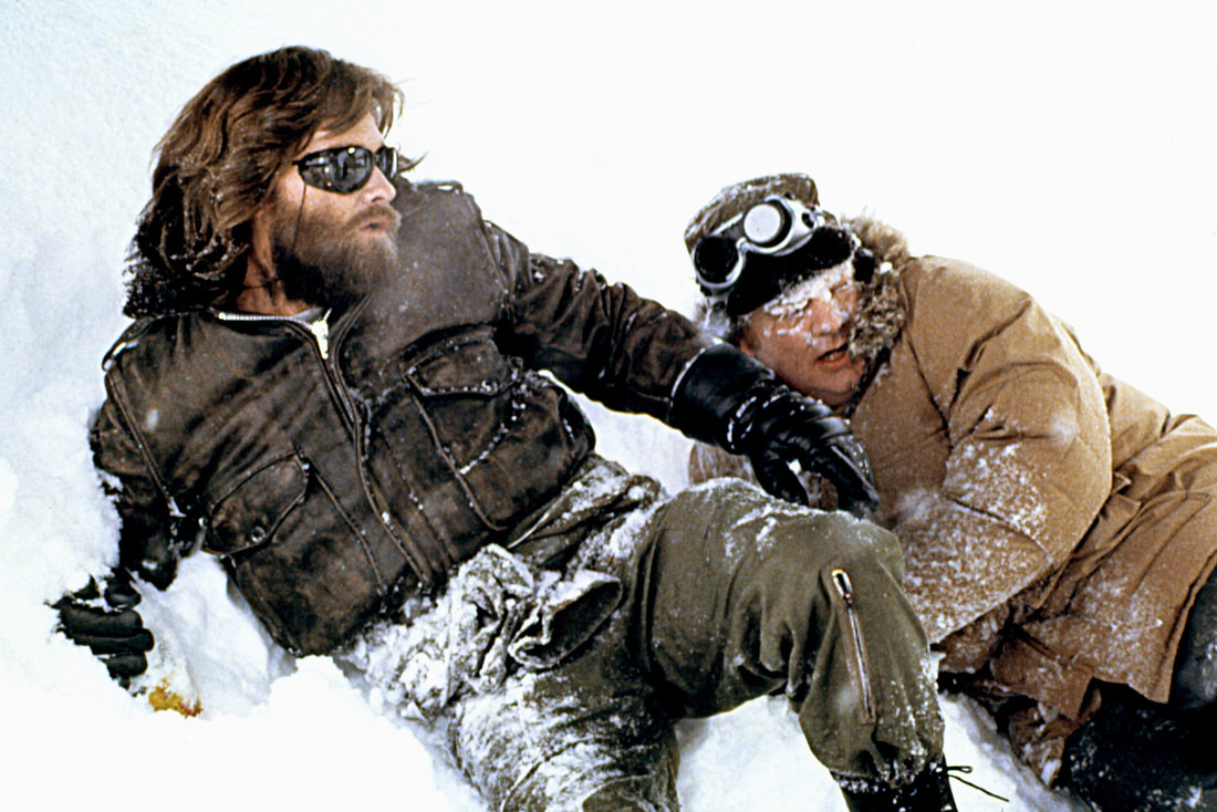 Kurt Russell and a friend frolicking in Snow in The Thing 1982